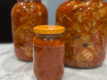 Kimchi is a spicy(in my case medium heat) fermented Napa cabbage condiment that is very popular in K