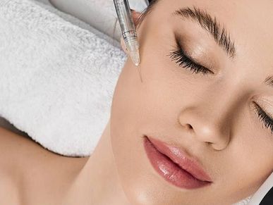 Patient receiving dermal filler injections for wrinkle smoothing  at Royal Derma Clinic.