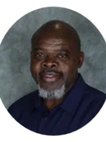 Portrait of smiling man with a gray beard.