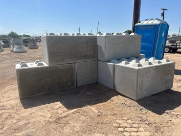 Stacked concrete blocks at a construction site.