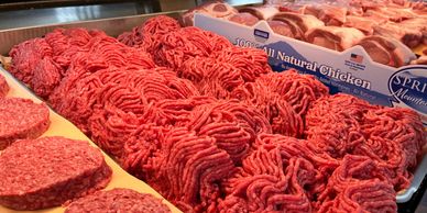 Fresh butcher counter at Dayly’s Farm Market featuring premium cuts of beef, pork, and chicken prepa