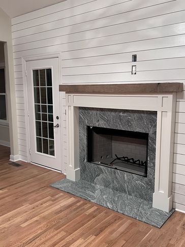A fireplace we installed and mantle we built along with shiplap we added to the walls