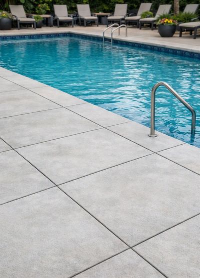 Concrete pool deck serviced with full wastewater recovery.