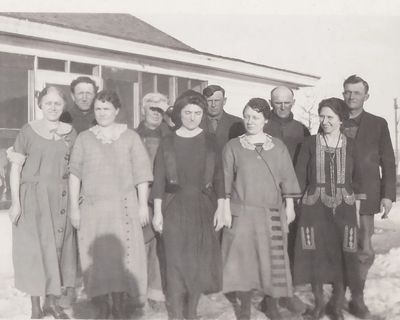 Vintage black and white photo of a farm famila circa 1920s. memoriesman.com organizes collections