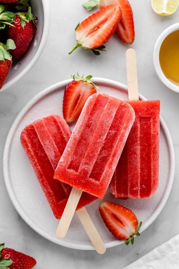 strawberry popsicle on a white plain plate