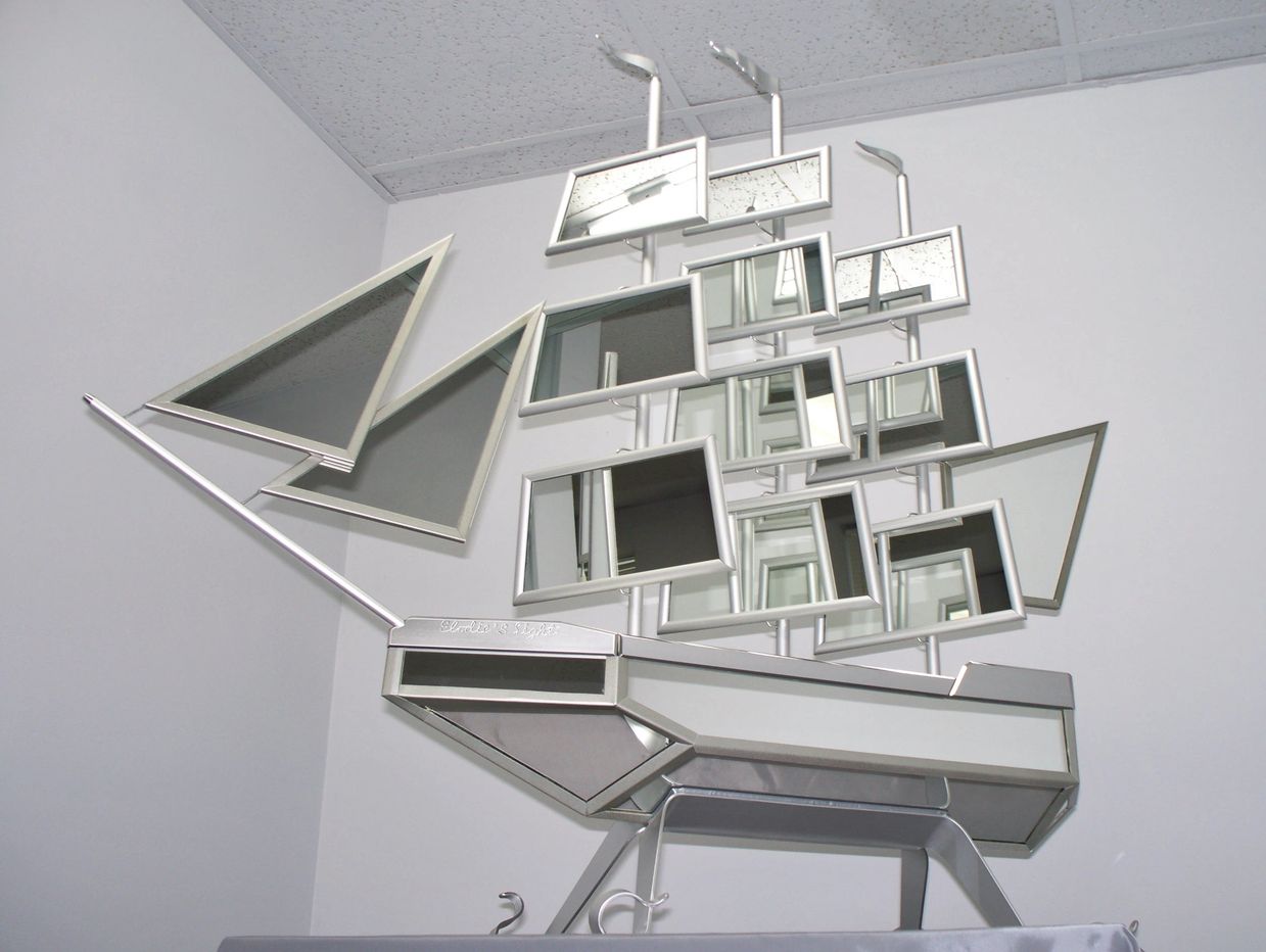 Mirror boat sculpture,unique in the world."Elodie' s Light", by Sylvain St-Pierre.