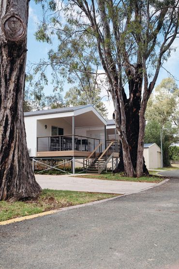Modern two-bedroom river view cabin with private deck at Bridgewater Caravan Park near Bendigo