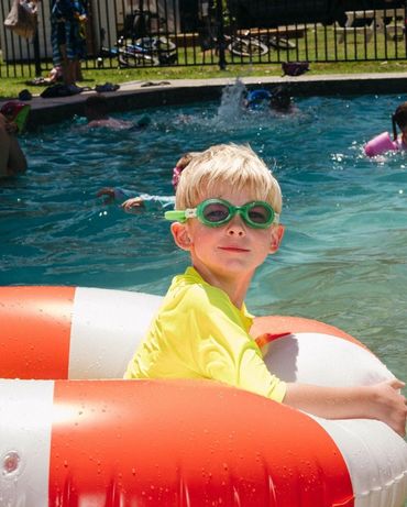 Child enjoying the heated swimming pool at family-friendly Bridgewater Caravan Park near Bendigo
