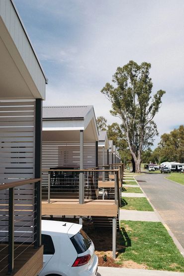 Modern river view cabins with elevated balconies at Bridgewater Caravan Park