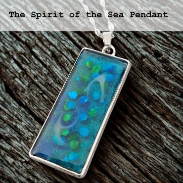 Rectangular sea-inspired pendant with blue and green shimmer.