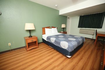 The room has one queen size beds and it is equipped with a fridge, microwave and a T.V.  including H