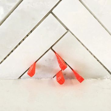 Detailed Installation of a Herringbone Mosaic Backsplash.