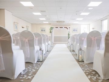 White elegant fitted chair covers for wedding and  event styling