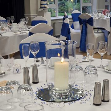 Hurricane vase centrepiece for wedding table styling and decoration hire