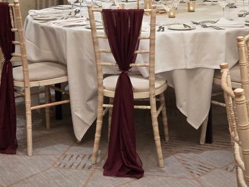 Burgundy chiffon chair drapes vailable to hire for weddings and events - Berkshire-Hampshire-Surrey.