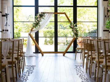 Hexagon backdrop creating a modern statement feature for wedding venue styling in Berkshire