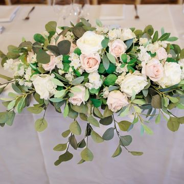 Low floral table arrangement for wedding decoration hire 