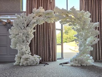 White blossom moongate creating an elegant statement feature for wedding venue styling