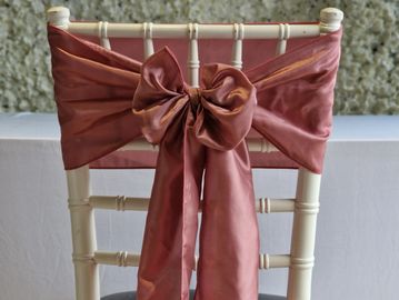 Dusky pink chair sash tied in a bow for elegant wedding chair styling