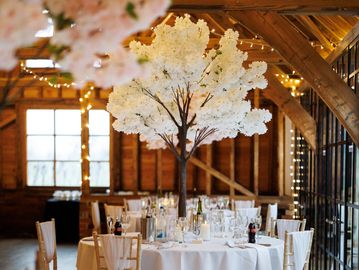 Tabletop blossom tree centrepiece for elegant wedding table styling