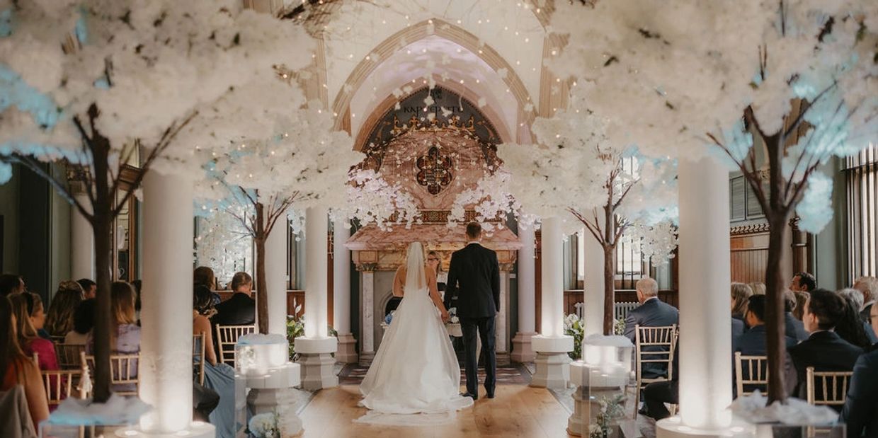 Wedding ceremony styling at Wotton House in Surrey with blossom trees