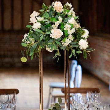 Tall floral wedding centrepiece for venue décor hire