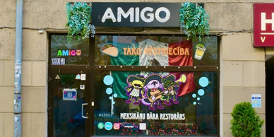 Mexican restaurant storefront with colorful decorations.