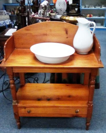 wooden washstand with pitcher and bowl