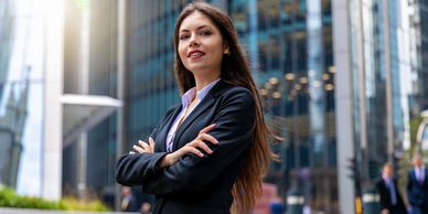 Young female consultant in front of office building