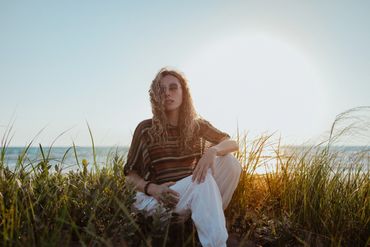 Model at beach during sunset