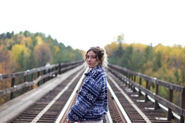 model standing on the midhurst train trestle