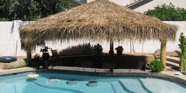 Sunken Bar Palapa with swimup bar stools. Get your custom palapa made by The Palapa Company. thatch