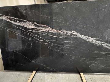 Black marble slab with white veins.