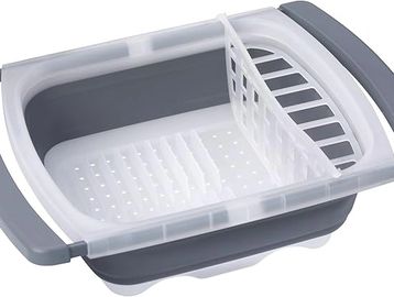 Collapsible dish rack with compartments for drying dishes.
