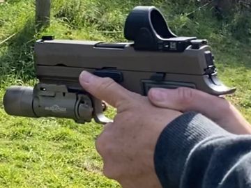 Red Dot pistol showing good hand grip on a range in Marin County, California for CCW online course.