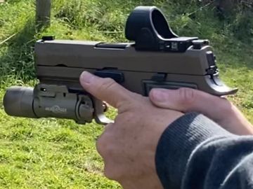 Red Dot pistol showing good hand grip.