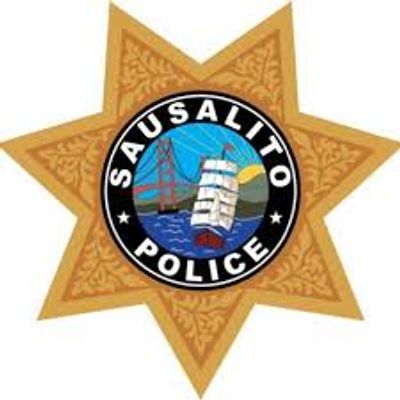 Badge of Sausalito Police with bridge and ship design.