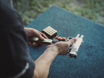 Pistol reloading on the range.