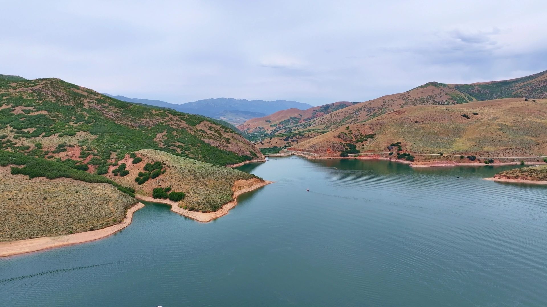 aerial drone view of lake with mountains