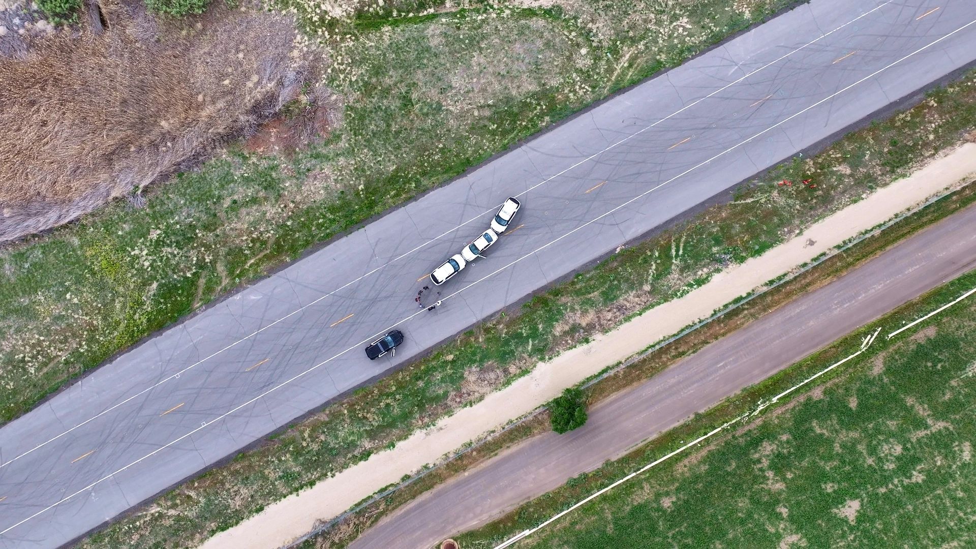 Birdseye view of 3 cars. view of the top of cars from sky