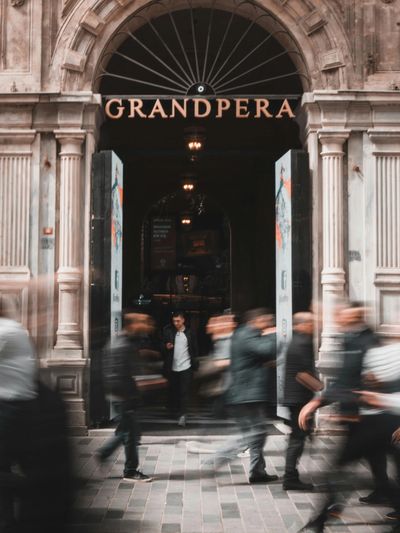 People walking outside a historcial building