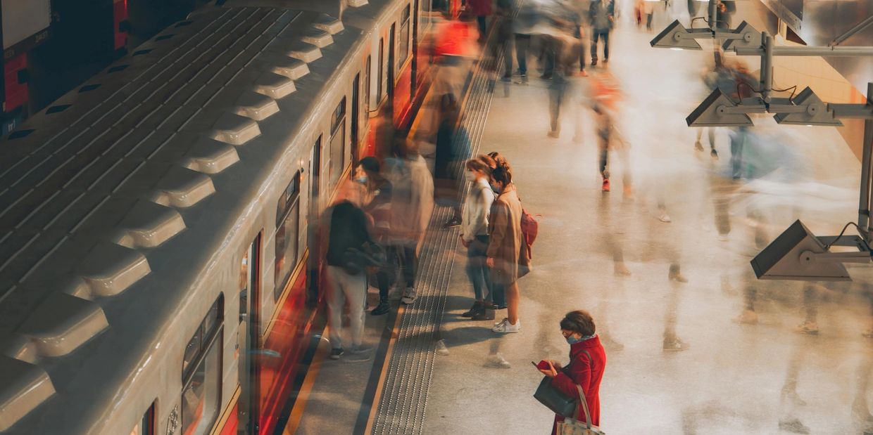 People waiting in a train terminal