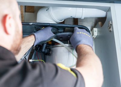 An engineer working on a boiler