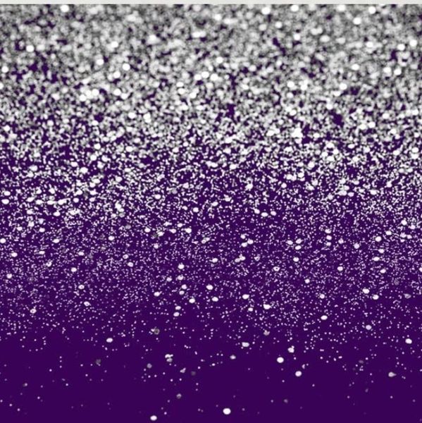 Silver glitter scattered over a purple background.