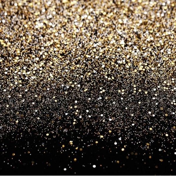 Gold and silver glitter scattered on a black background.