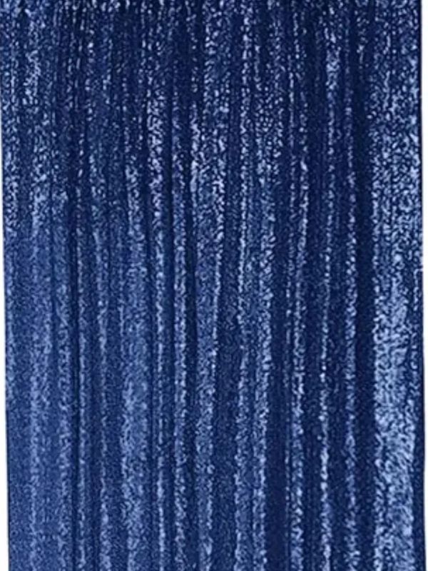 Close-up of a textured blue velvet fabric with vertical folds. Photobooth Tehachapi