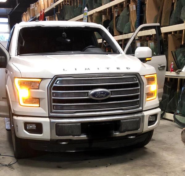 2017 white ford f150 getting a windshield replaced 