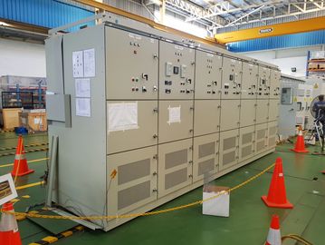 Industrial electrical control panel inside a factory setting.