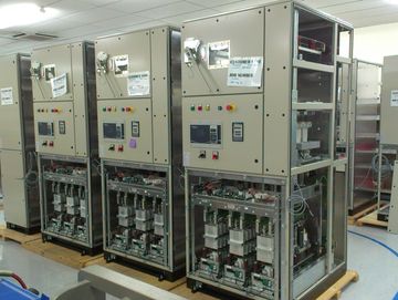 Industrial electrical control panels in a manufacturing facility.