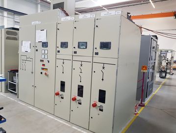Industrial electrical control panels with switches and meters in a factory.